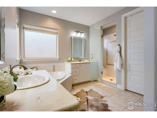 a bathroom with a bathtub and a window