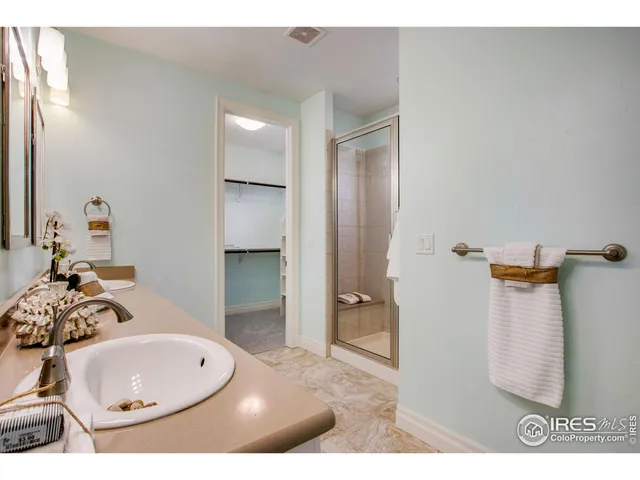 a kitchen with a sink a stove and cabinets