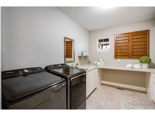 a view of a livingroom with furniture and a window