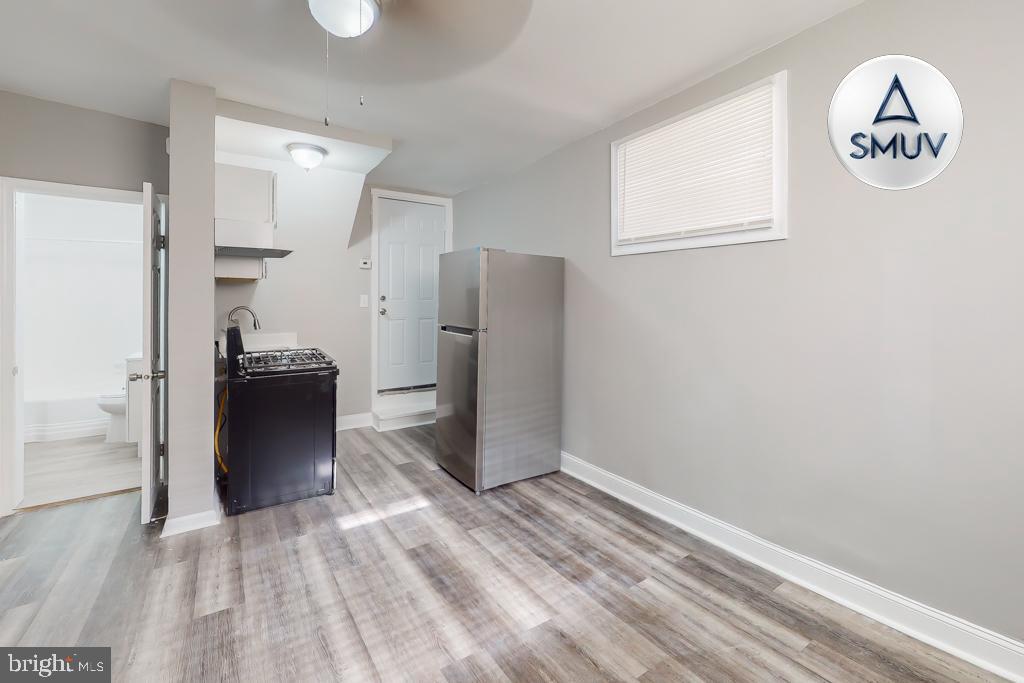 1605 Homestead Street, Unit 12 Baltimore, MD 21218 - Photo 12 of 12 a view of a hallway with entryway and stairs