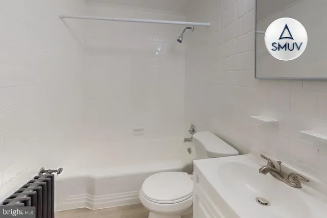 a stove top oven sitting inside of a kitchen