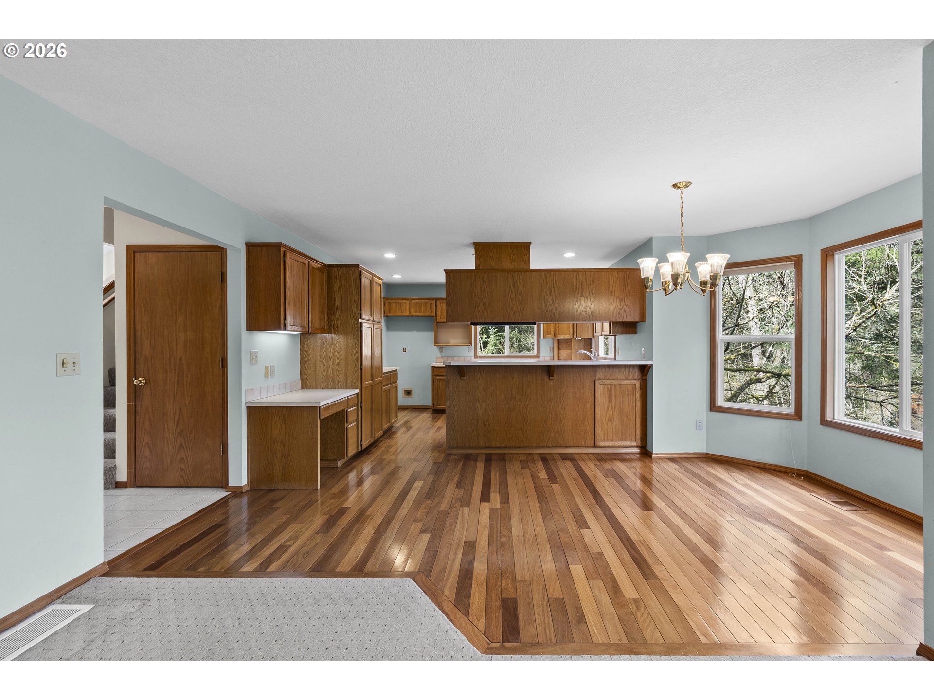7574 Southwest 179th Place Beaverton, OR 97007 - Photo 11 of 48 a living room with stainless steel appliances kitchen island granite countertop furniture and a kitchen view