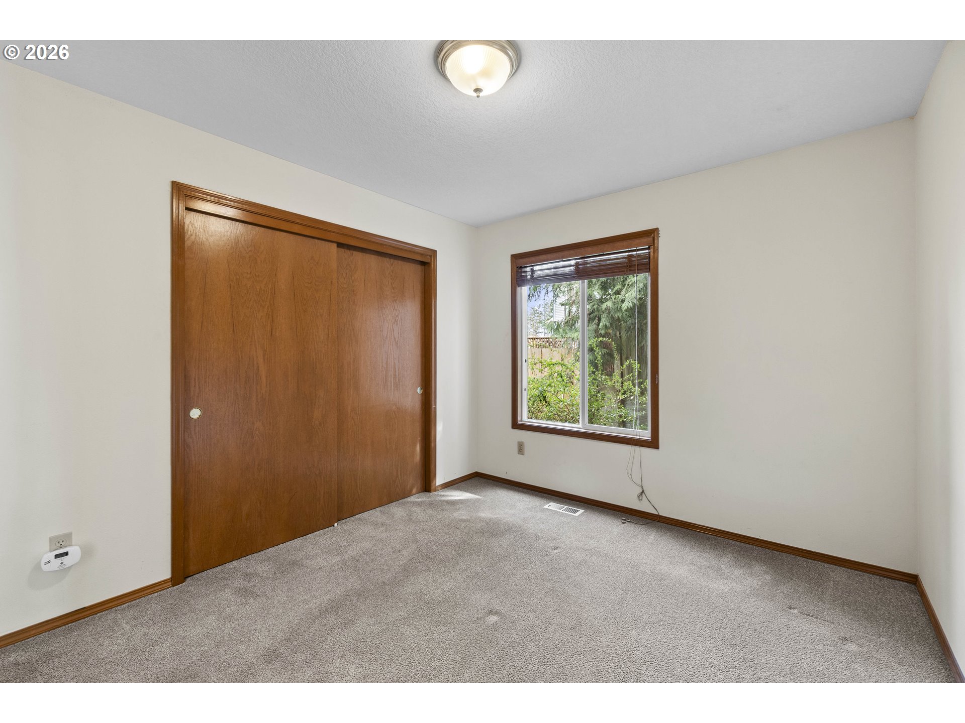 7574 Southwest 179th Place Beaverton, OR 97007 - Photo 20 of 48 a view of an empty room with a window