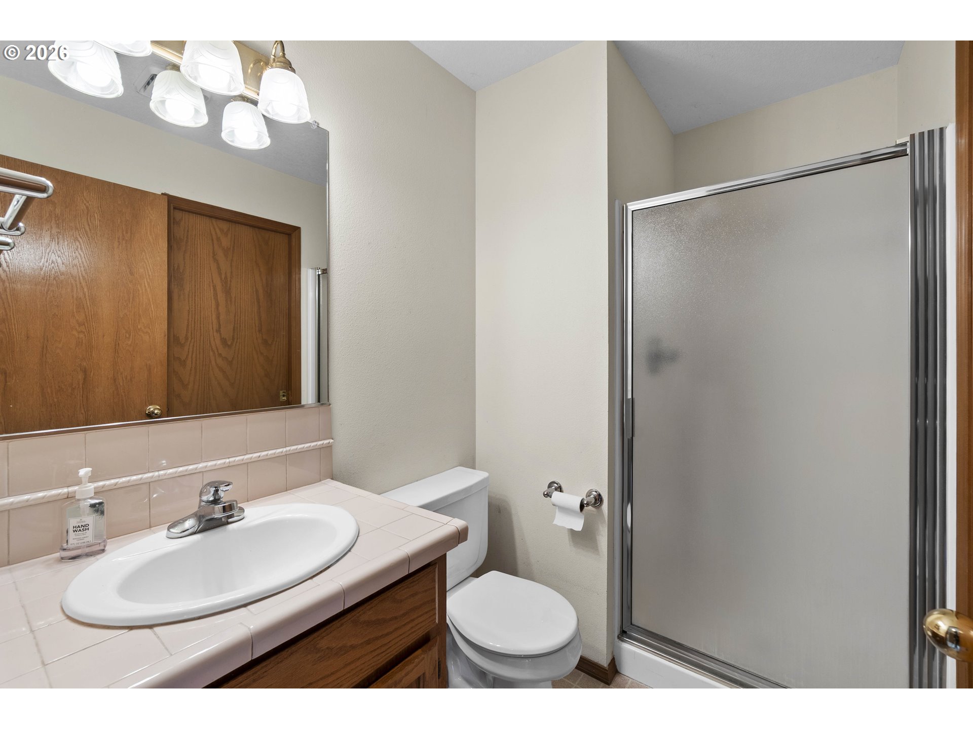 7574 Southwest 179th Place Beaverton, OR 97007 - Photo 22 of 48 a bathroom with a sink toilet and mirror