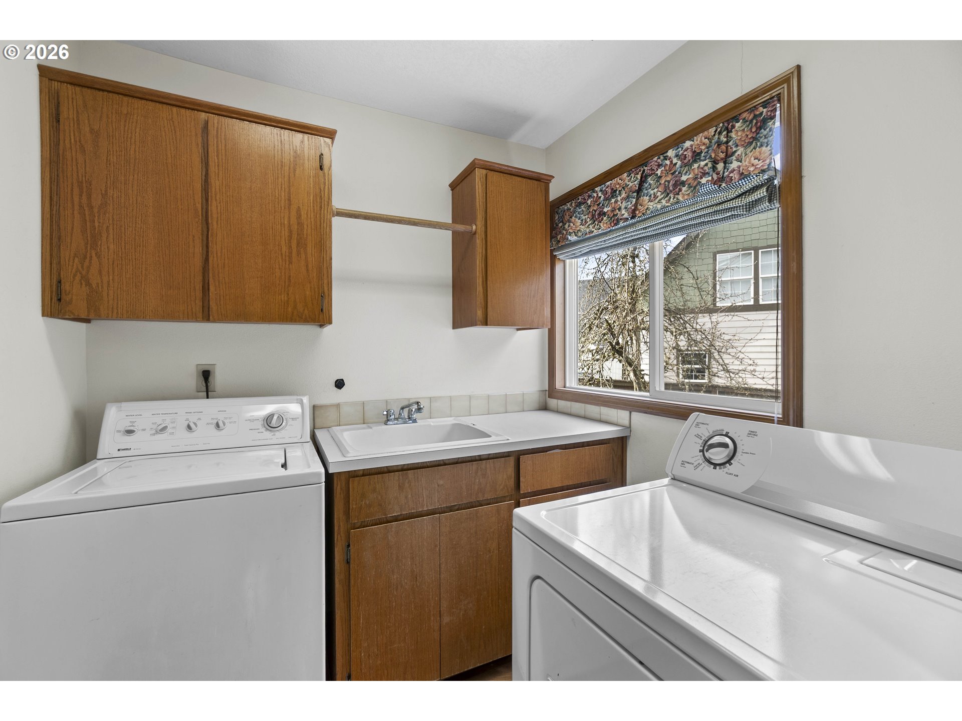 7574 Southwest 179th Place Beaverton, OR 97007 - Photo 23 of 48 a utility room with a sink a washer and dryer