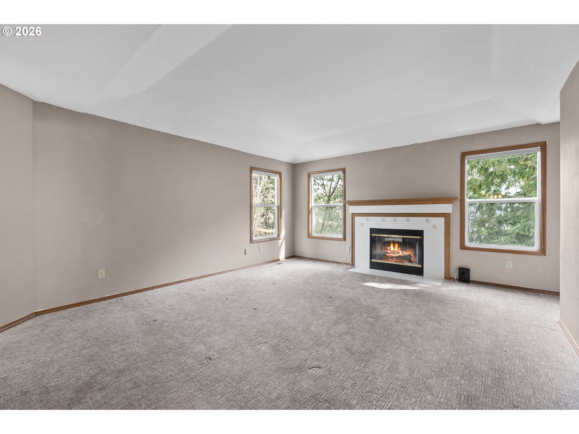 7574 Southwest 179th Place Beaverton, OR 97007 - Photo 24 of 48 a view of empty room with a fireplace