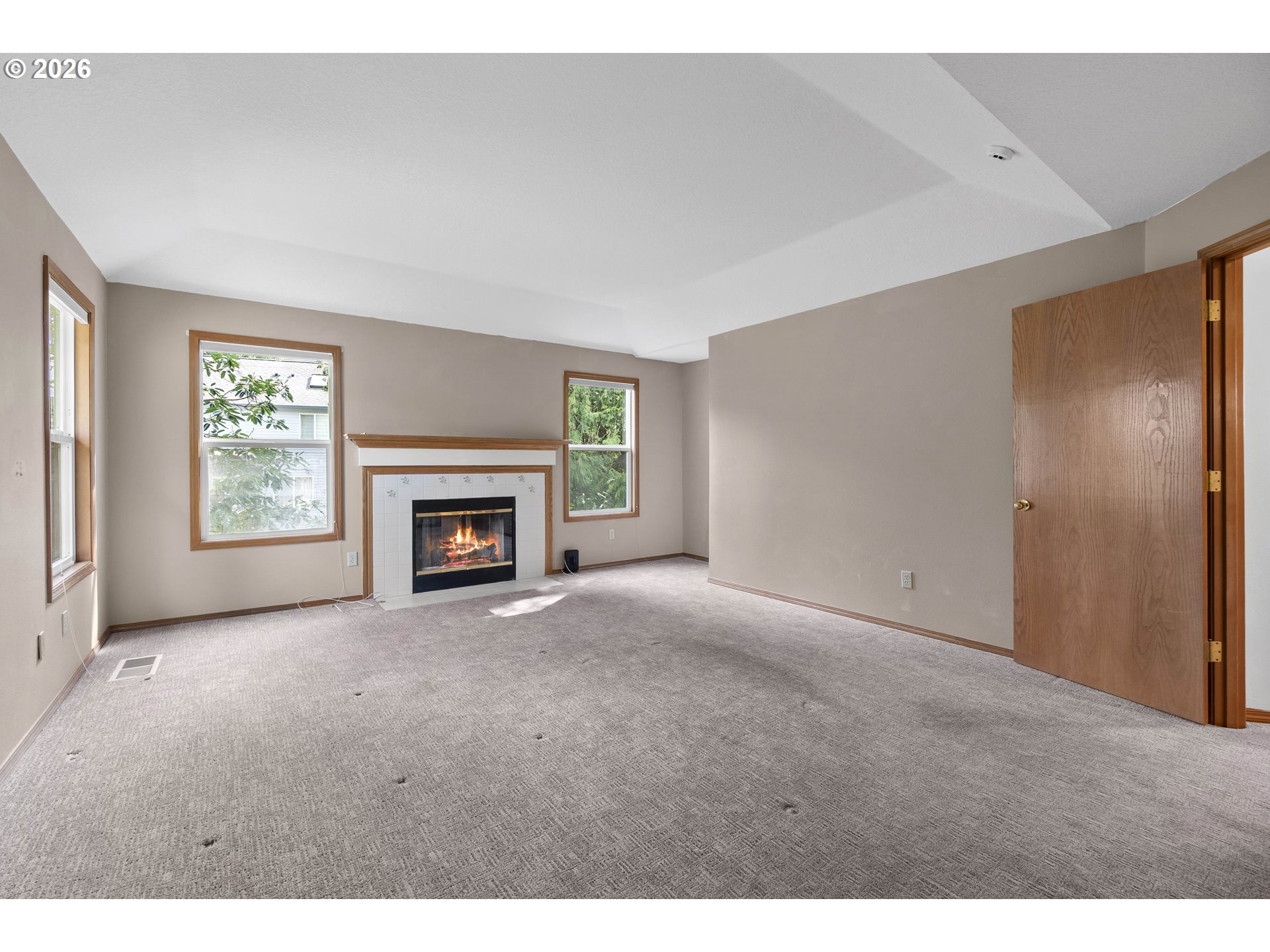 7574 Southwest 179th Place Beaverton, OR 97007 - Photo 26 of 48 a view of empty room with a fireplace