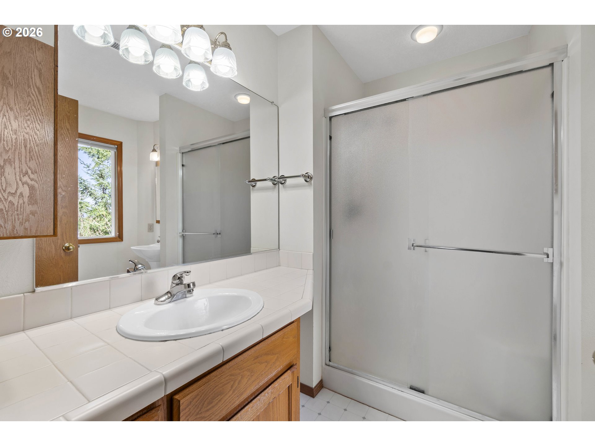 7574 Southwest 179th Place Beaverton, OR 97007 - Photo 28 of 48 a bathroom with a sink and a mirror