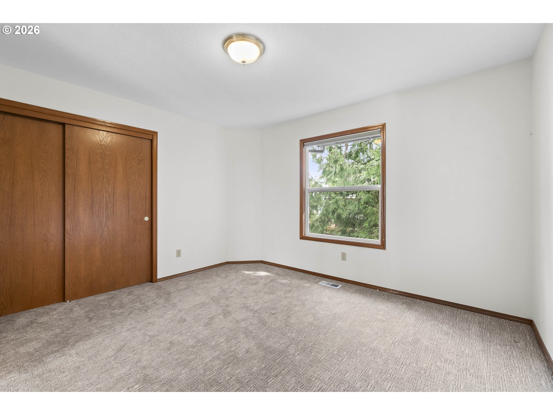 7574 Southwest 179th Place Beaverton, OR 97007 - Photo 31 of 48 a view of an empty room with a window