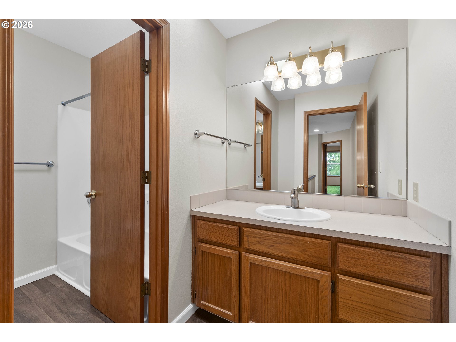 7574 Southwest 179th Place Beaverton, OR 97007 - Photo 35 of 48 a bathroom with a sink vanity and a mirror