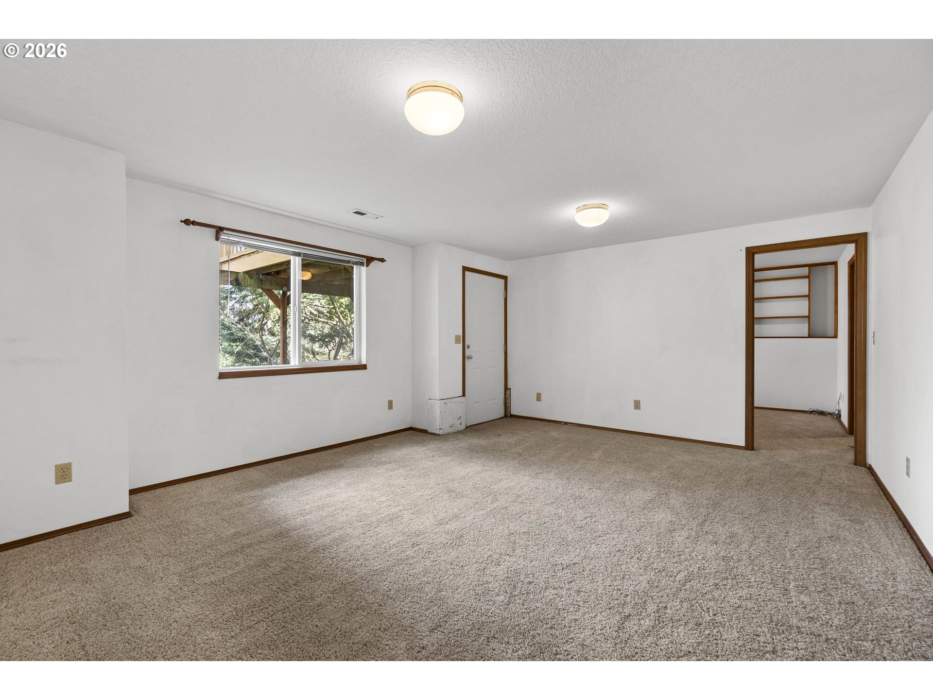 7574 Southwest 179th Place Beaverton, OR 97007 - Photo 37 of 48 a view of an empty room with a window