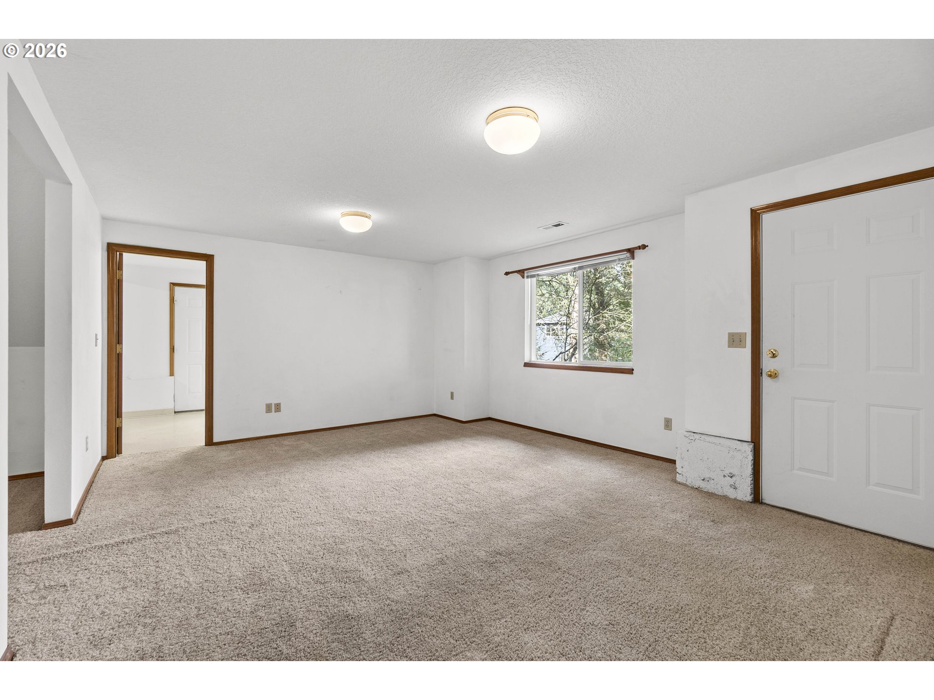 7574 Southwest 179th Place Beaverton, OR 97007 - Photo 38 of 48 a view of an empty room with a window