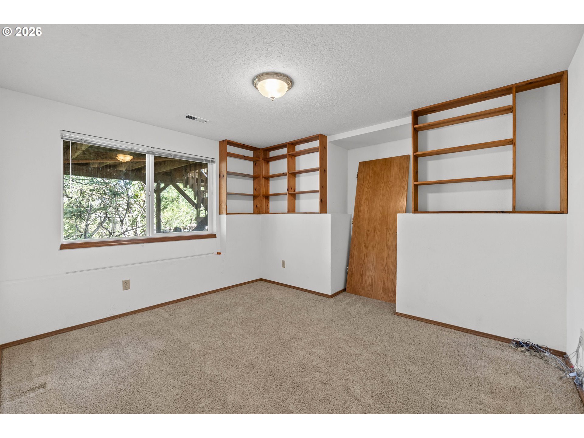 7574 Southwest 179th Place Beaverton, OR 97007 - Photo 39 of 48 a view of an empty room with a window