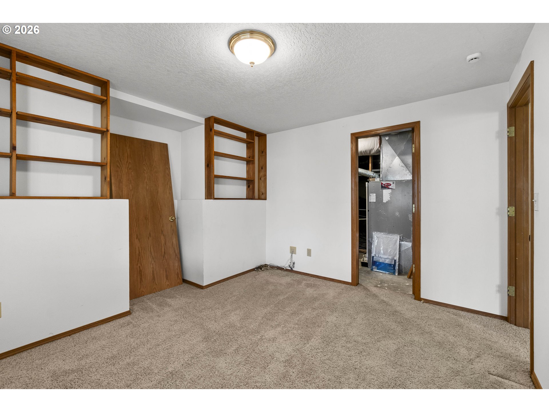 7574 Southwest 179th Place Beaverton, OR 97007 - Photo 40 of 48 an empty room with windows and closet