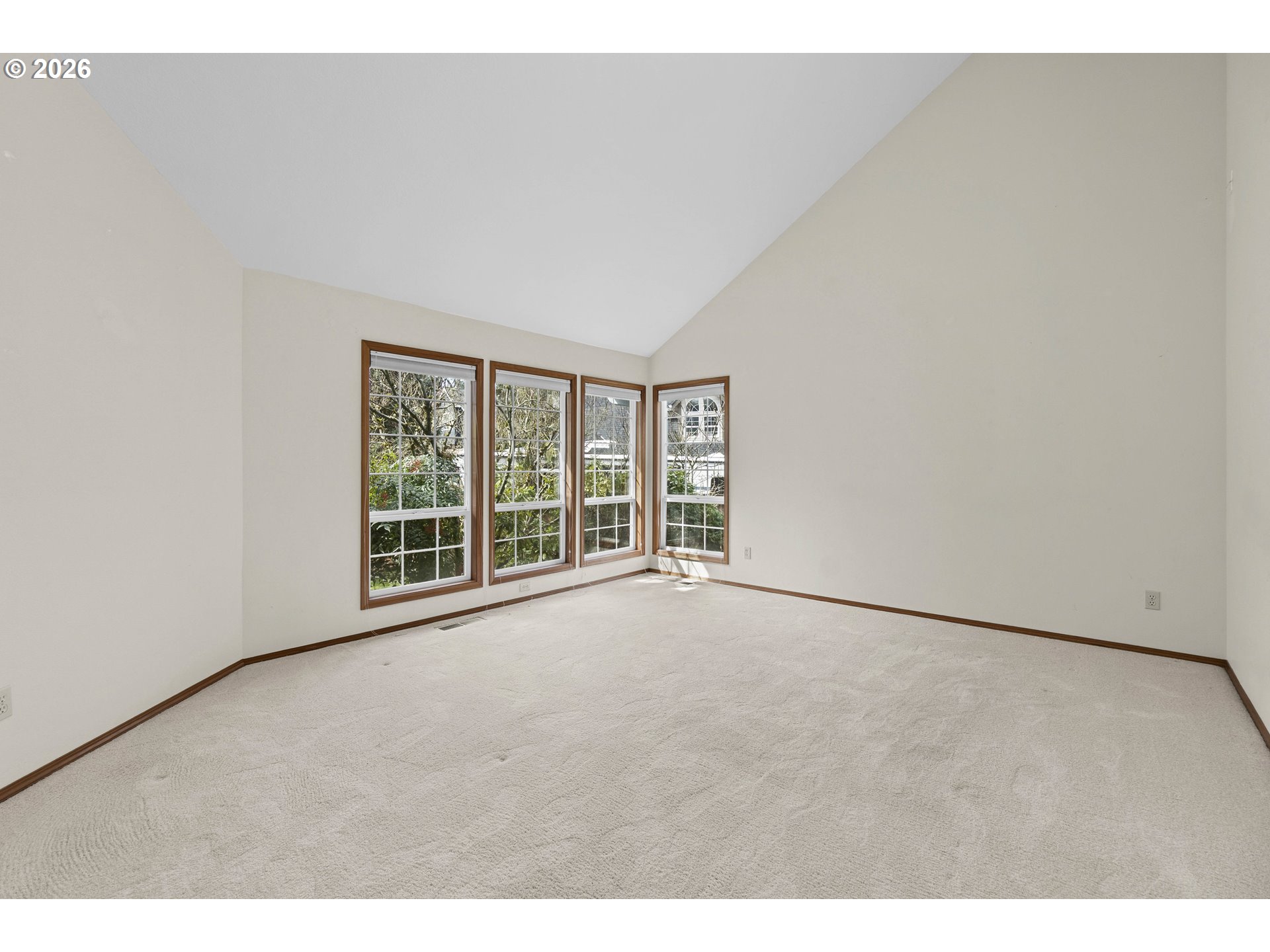 7574 Southwest 179th Place Beaverton, OR 97007 - Photo 6 of 48 a view of an empty room with a window