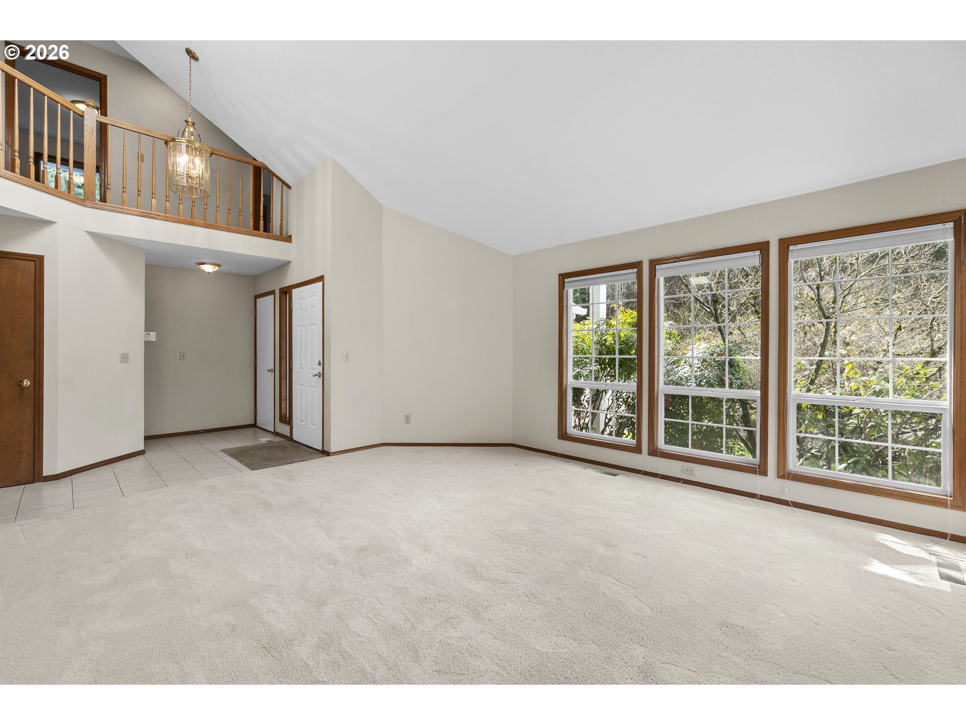 7574 Southwest 179th Place Beaverton, OR 97007 - Photo 7 of 48 a view of an empty room with a floor to ceiling window and floor to ceiling window
