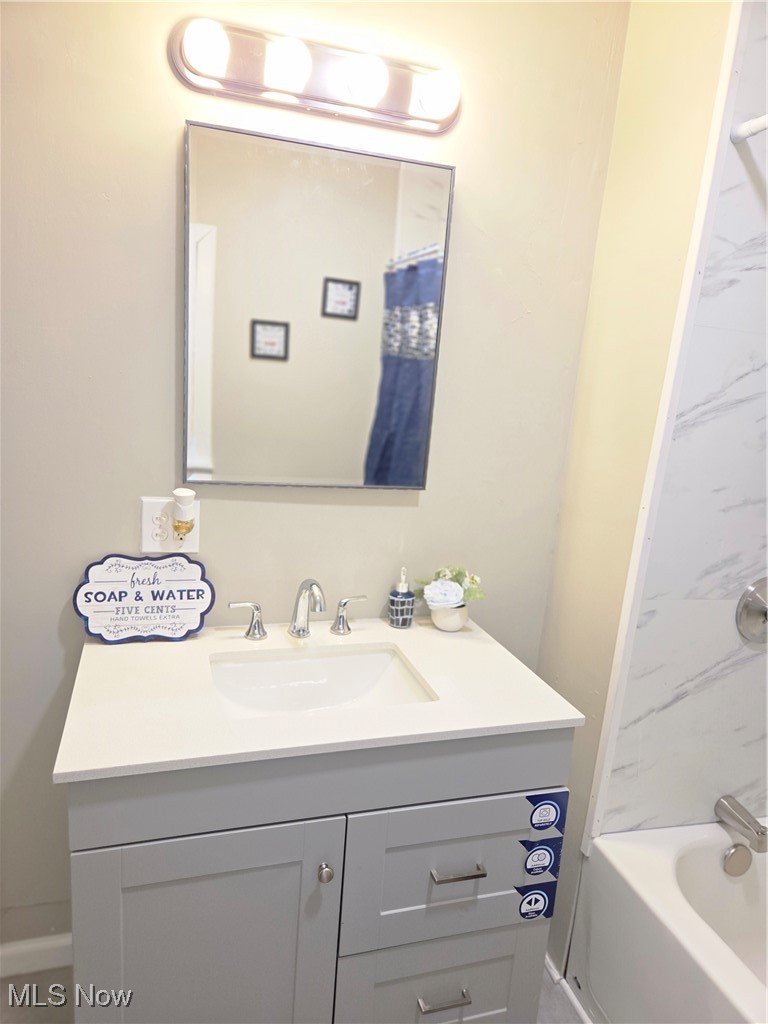 3797 Delmore Road Cleveland, OH 44121 - Photo 22 of 39 Full bath featuring new vanity and shower / bathtub combination with curtain