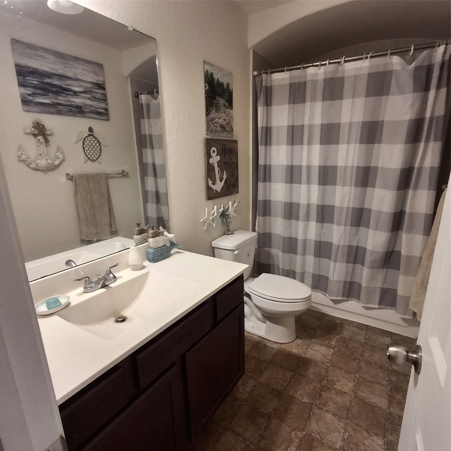 3034 Tandem Court Rosenberg, TX 77471 - Photo 24 of 27 a bathroom with a sink a toilet a mirror and shower curtain