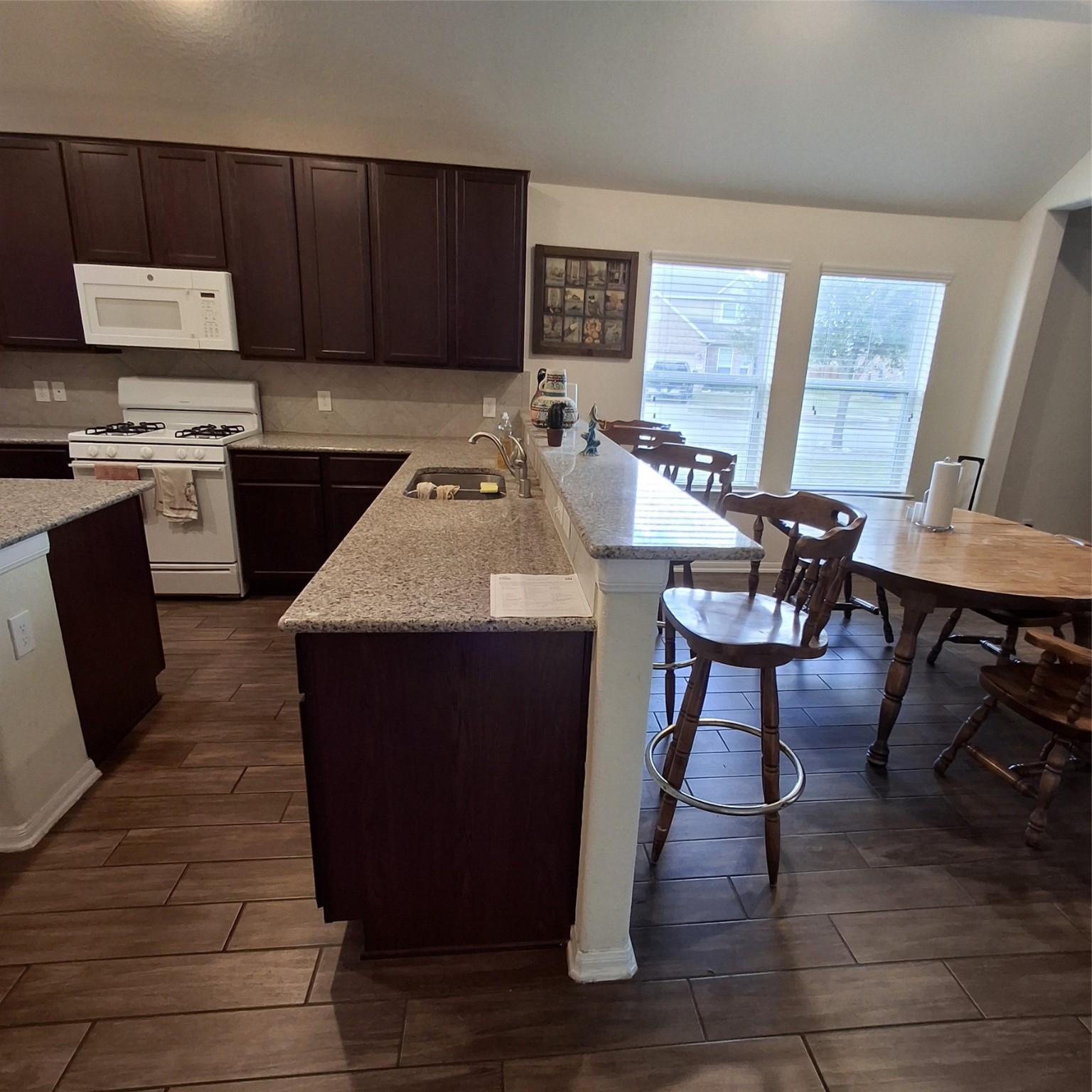3034 Tandem Court Rosenberg, TX 77471 - Photo 9 of 27 a kitchen with a sink cabinets and window