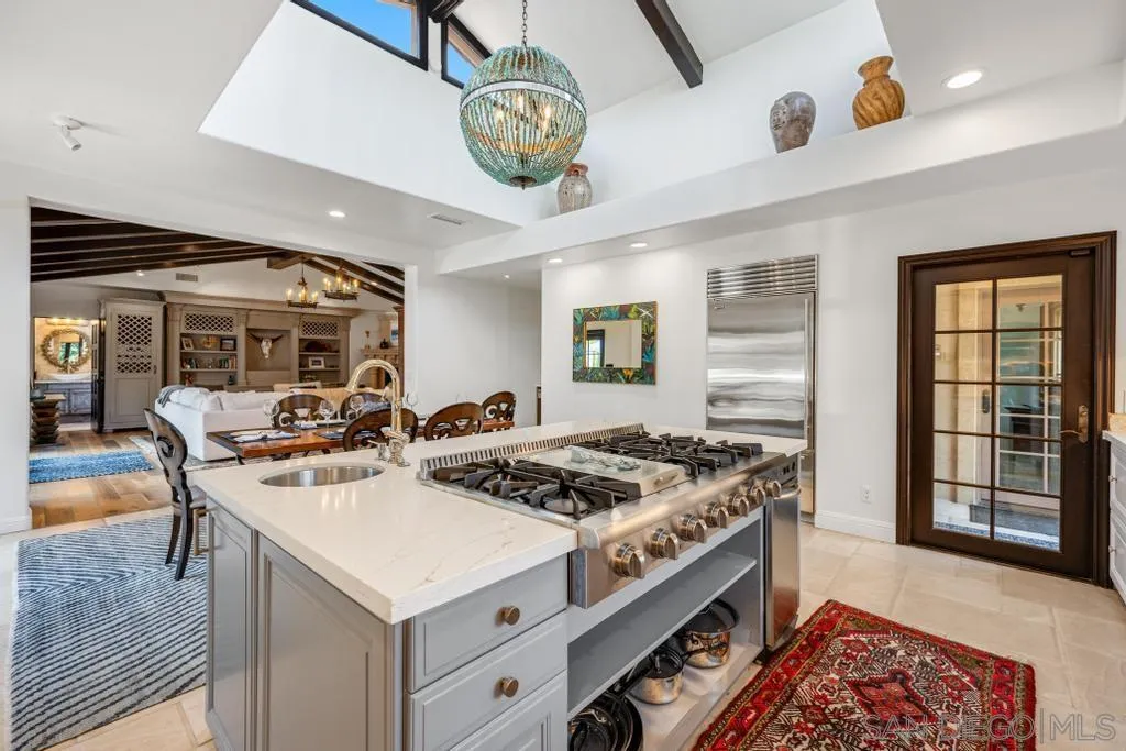 2643 Hidden Valley Road La Jolla, CA 92037 - Photo 27 of 61 a kitchen that has a stove and a table