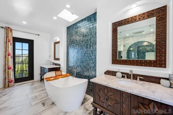 a bathroom with a double vanity sink and a mirror