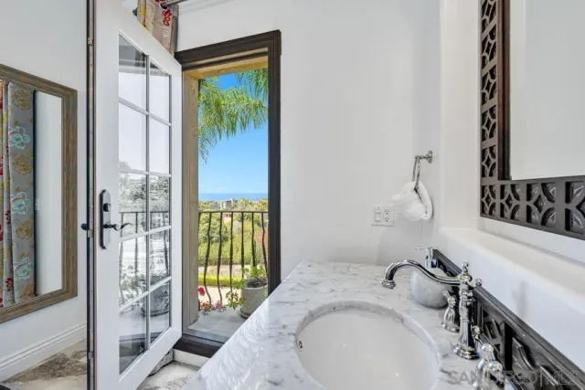 a bedroom with a large bed and a dresser