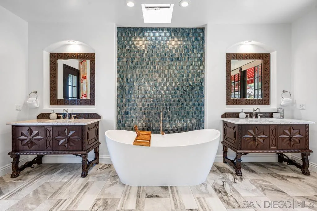2643 Hidden Valley Road La Jolla, CA 92037 - Photo 39 of 61 a living room with a table and a potted plant