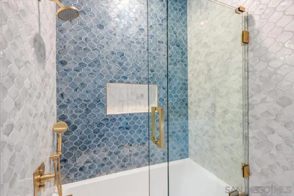 a living room with patio furniture and a large window