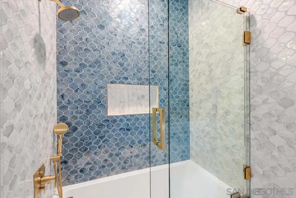 2643 Hidden Valley Road La Jolla, CA 92037 - Photo 44 of 61 a bathroom with a shower and a sink