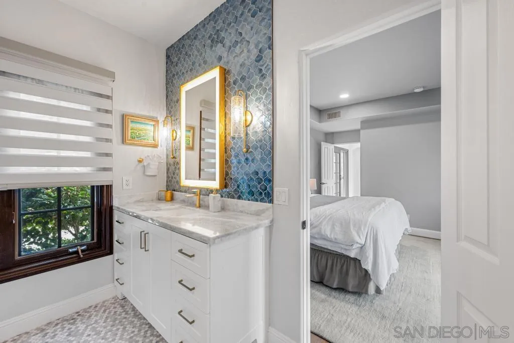 2643 Hidden Valley Road La Jolla, CA 92037 - Photo 45 of 61 a bathroom with a sink and a mirror
