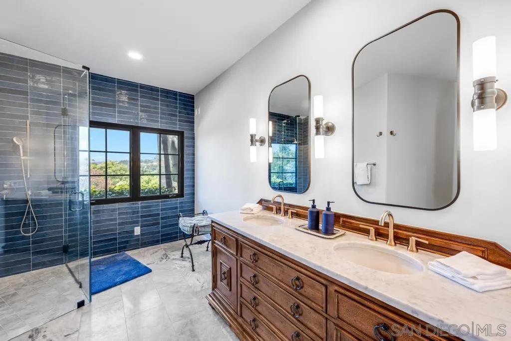 2643 Hidden Valley Road La Jolla, CA 92037 - Photo 46 of 61 a bathroom with a double vanity sink and a mirror