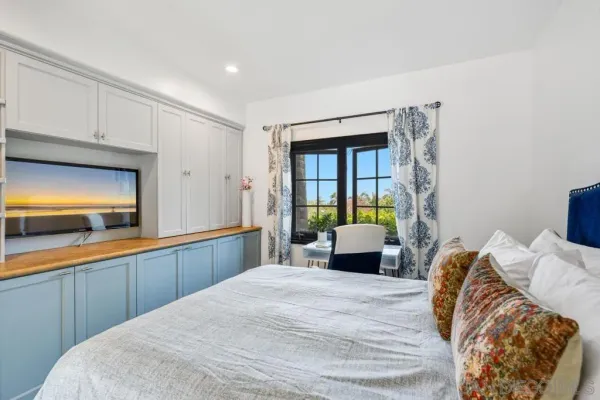 a dining room with furniture a fireplace and a chandelier