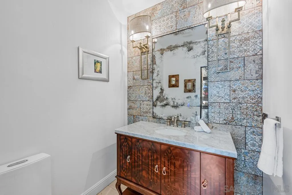 2643 Hidden Valley Road La Jolla, CA 92037 - Photo 50 of 61 a bathroom with a sink and a mirror