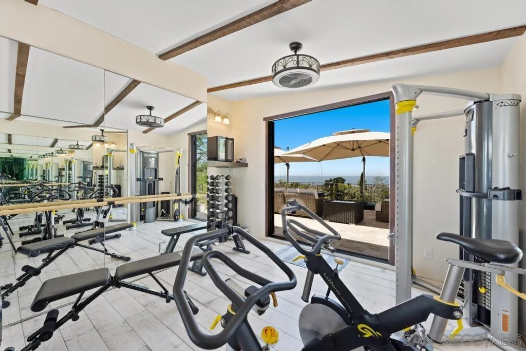 2643 Hidden Valley Road La Jolla, CA 92037 - Photo 58 of 61 a view of a livingroom with furniture and a floor to ceiling window
