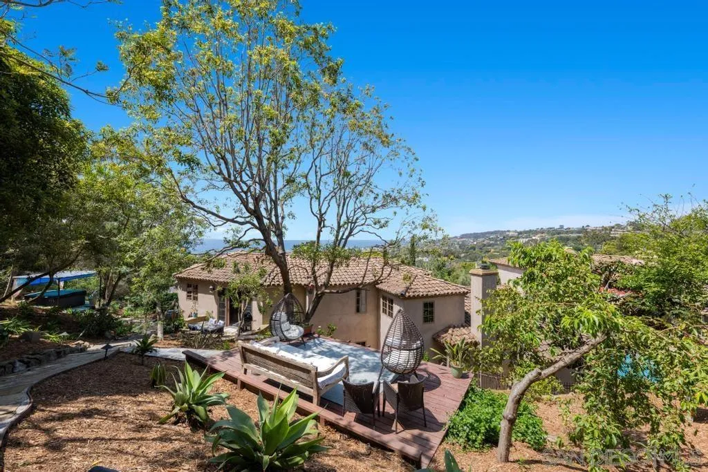 2643 Hidden Valley Road La Jolla, CA 92037 - Photo 60 of 61 a view of a patio with table and chairs and potted plants