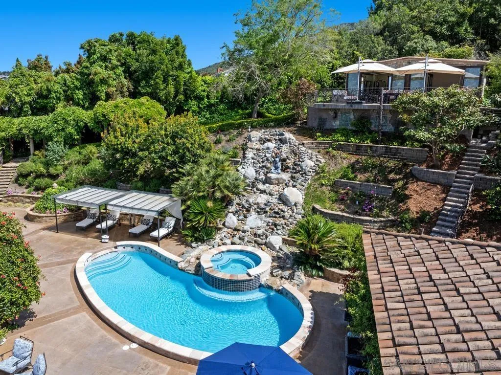 2643 Hidden Valley Road La Jolla, CA 92037 - Photo 9 of 61 a view of a chairs and table in backyard
