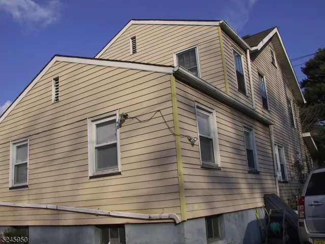 a view of a house with a window and wooden floor