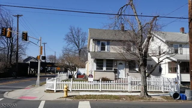 a view of a house with a iron gate