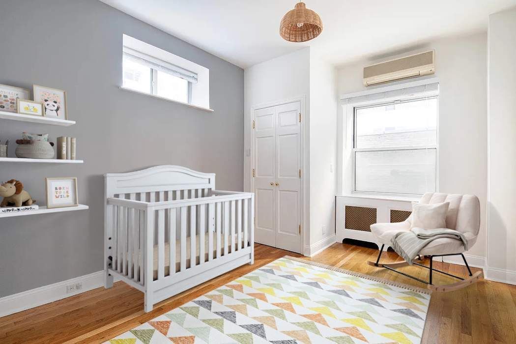 61 East 77th Street, Unit 3EF Manhattan, NY 10075 - Photo 6 of 12 a bedroom with furniture and a window