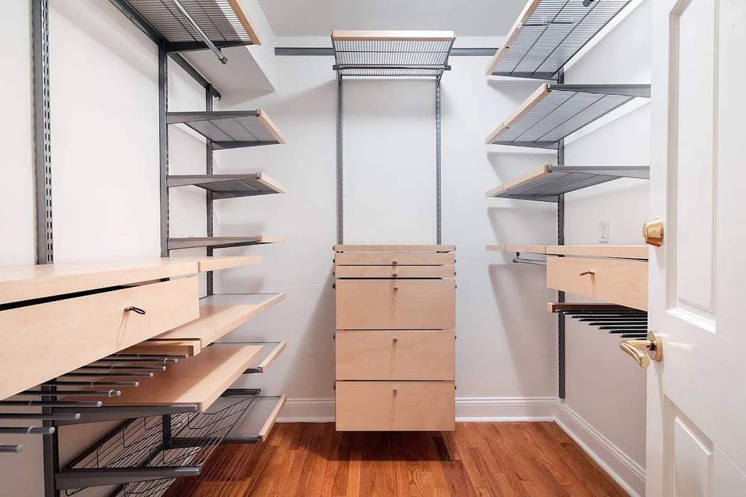 61 East 77th Street, Unit 3EF Manhattan, NY 10075 - Photo 9 of 12 a view of walk in closet with empty racks