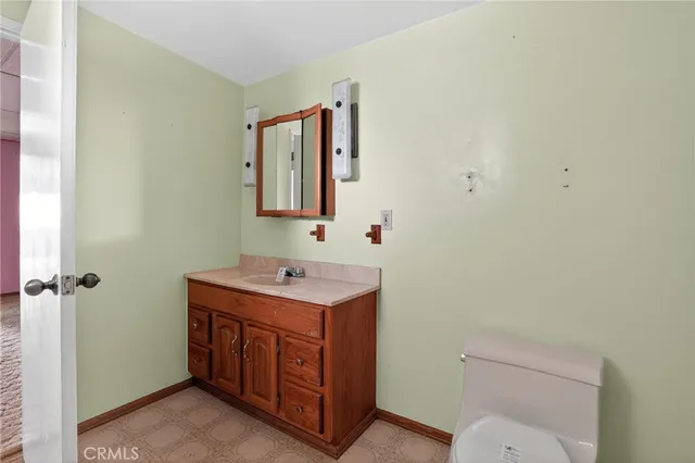 a bathroom with a toilet and a bathtub
