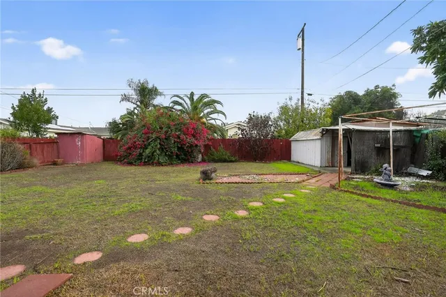 a front view of a house with swimming pool garden and patio