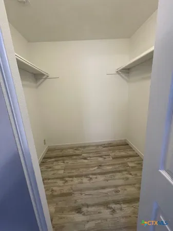 a bathroom with a sink a toilet a mirror and shower