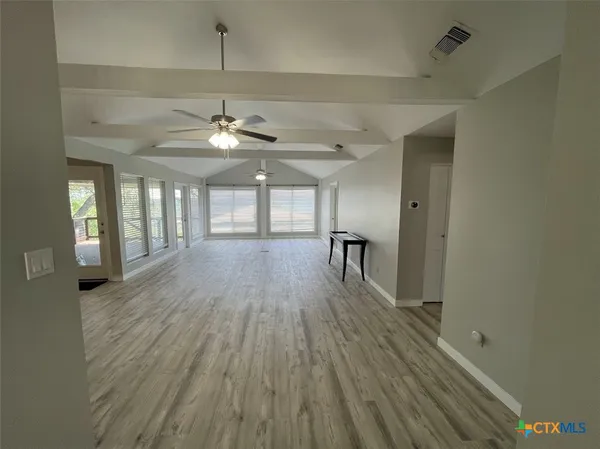 a kitchen with stainless steel appliances kitchen island granite countertop a sink and cabinets