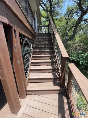 a view of balcony with wooden floor