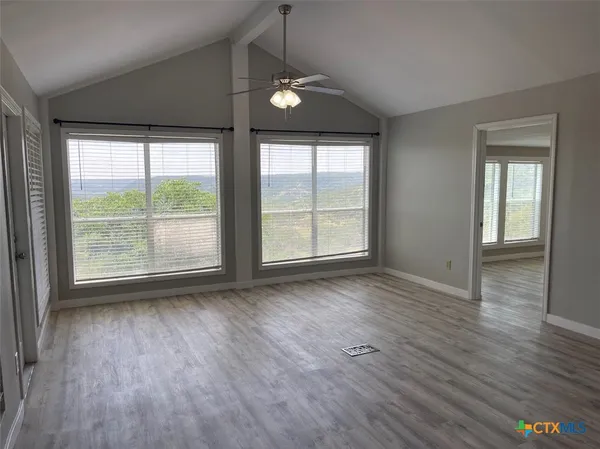 a view of a livingroom with furniture nad wooden floor