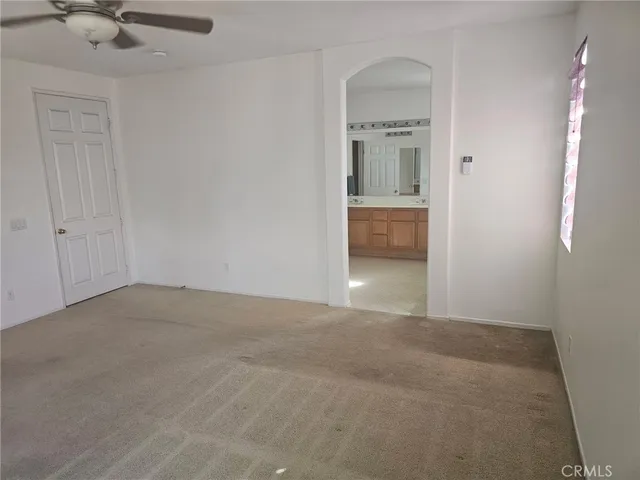 a view of a bathroom with a sink and a mirror