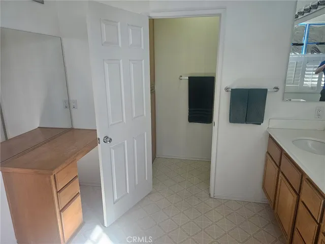a utility room with cabinets washer and dryer