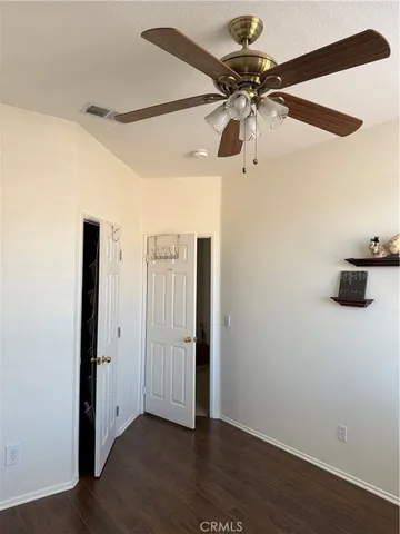 a view of room with windows and cabinet
