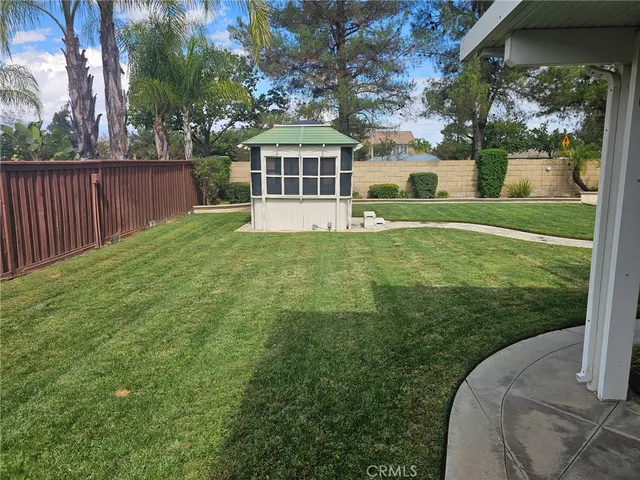 a view of a porch with furniture and garden